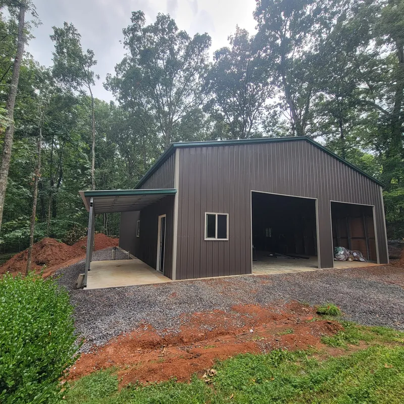 Burnished slate workshop with a vertical roof and an attached open lean-to